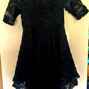 Beautiful high-low cocktail dress. Worn once for wedding, so many compliments!